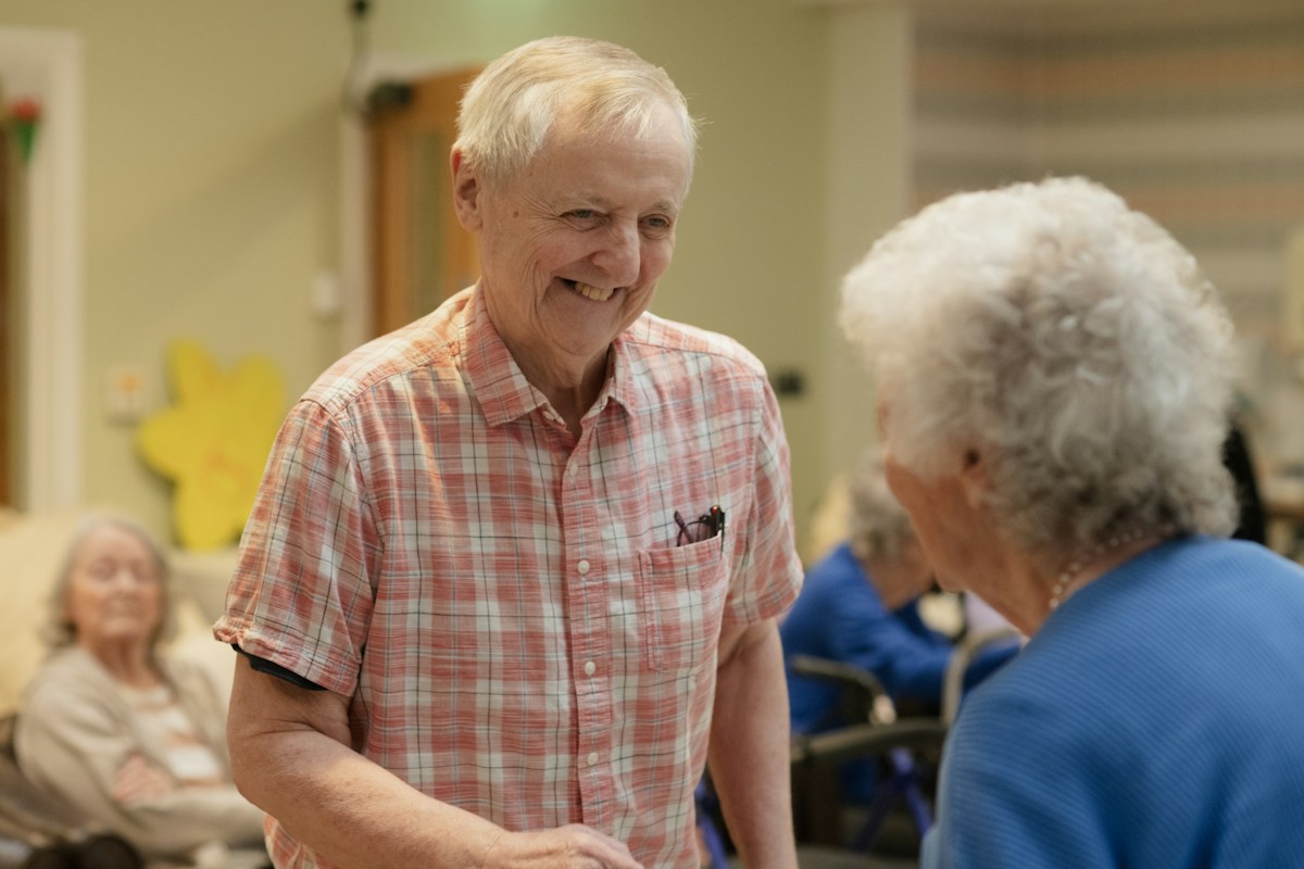 Older adults sharing a friendly conversation