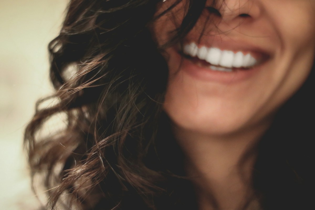 A close-up smile, photographed in natural light